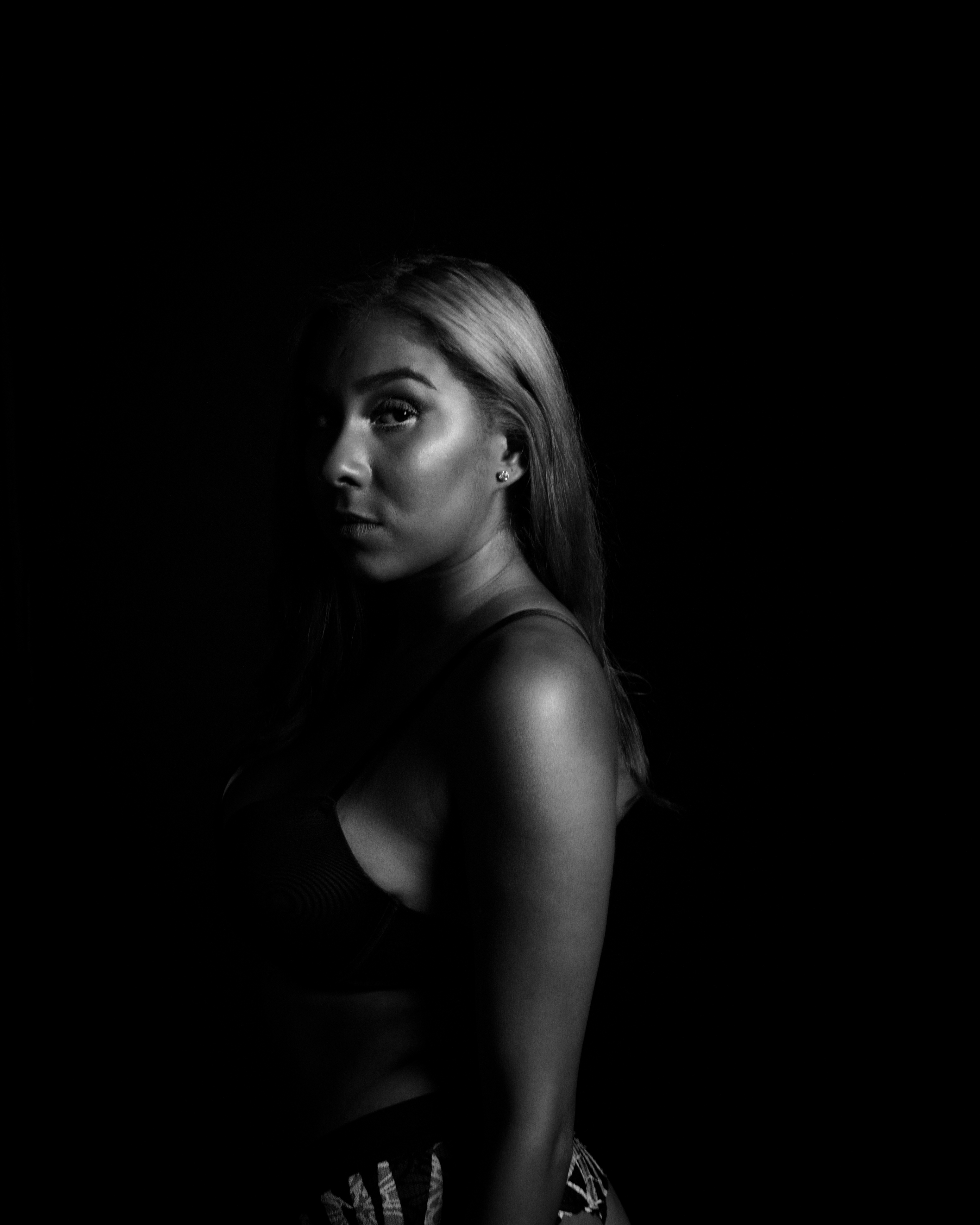 Grayscale Side View Photo of Woman Posing